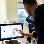 Doctor examining dental screen